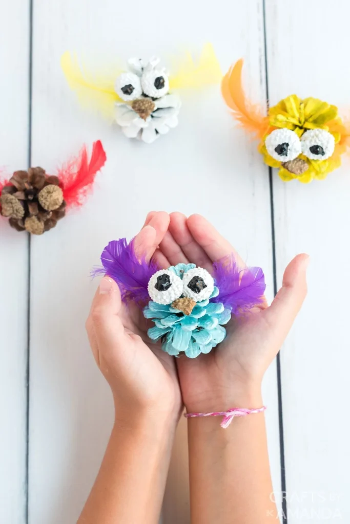 22 Fantastic Feather Crafts 14 13. Pinecone Owls