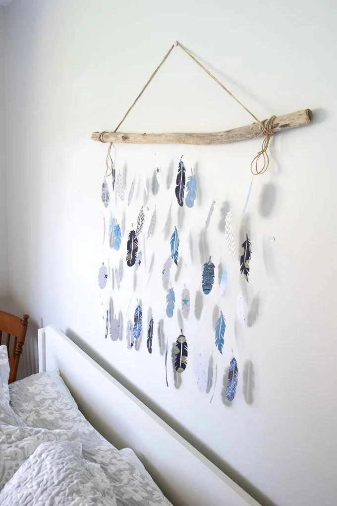 22 Fantastic Feather Crafts 15 14. Cricut Feather Wall Decor