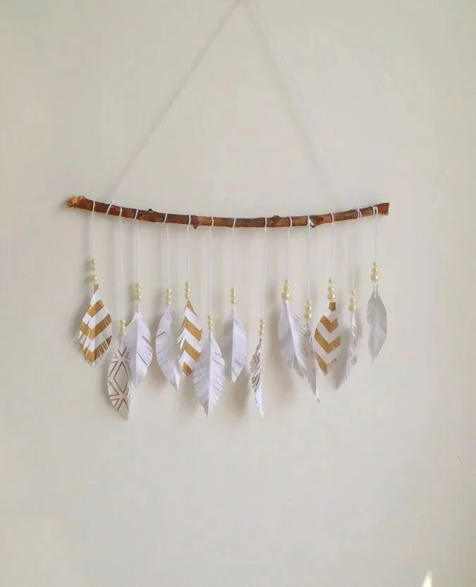 21 Exciting Paper Crafts for Kids 15 14. Paper Feather Wall Hanger