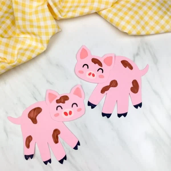 27 Paper Crafts That Will Inspire Anyone 16 15 handprint pig craft preschool image 1